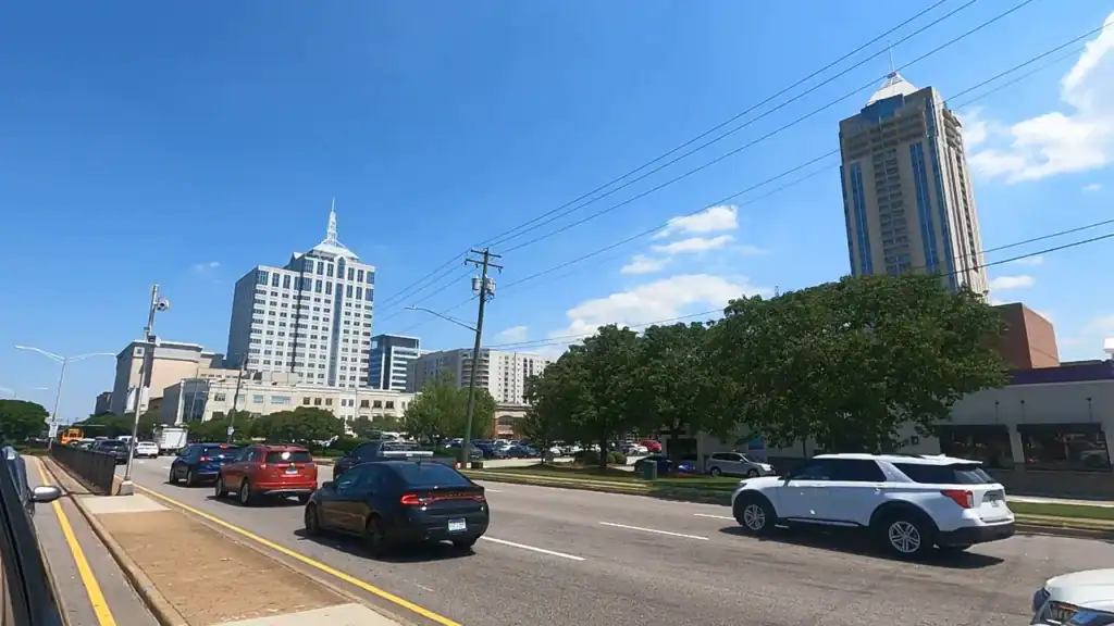 Street-level view of traffic and high-rise buildings at Virginia Beach Town Center